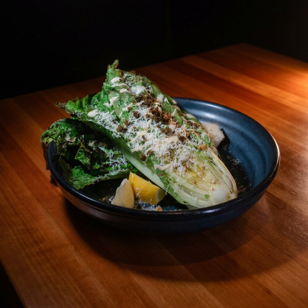 Grilled romaine Caesar salad with capers, parmesan and lemon